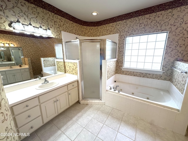 bathroom featuring tile patterned flooring, vanity, and plus walk in shower