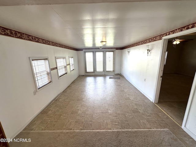 spare room with ceiling fan