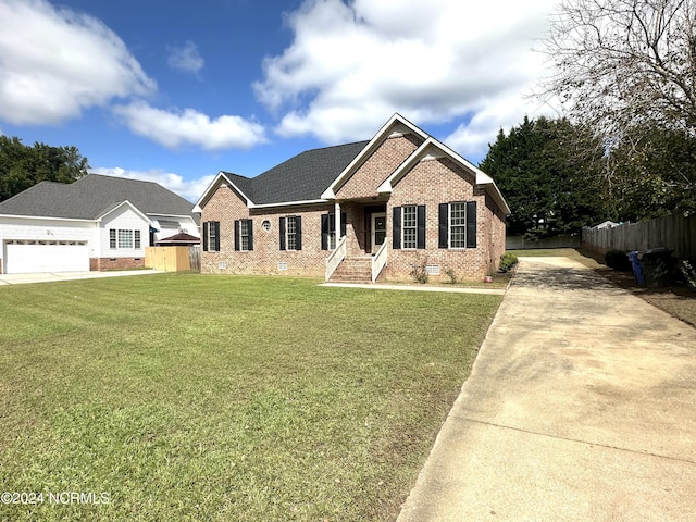 view of front of property with concrete driveway, fence, crawl space, a front lawn, and brick siding