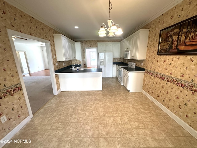 kitchen with crown molding, a chandelier, a peninsula, white appliances, and wallpapered walls