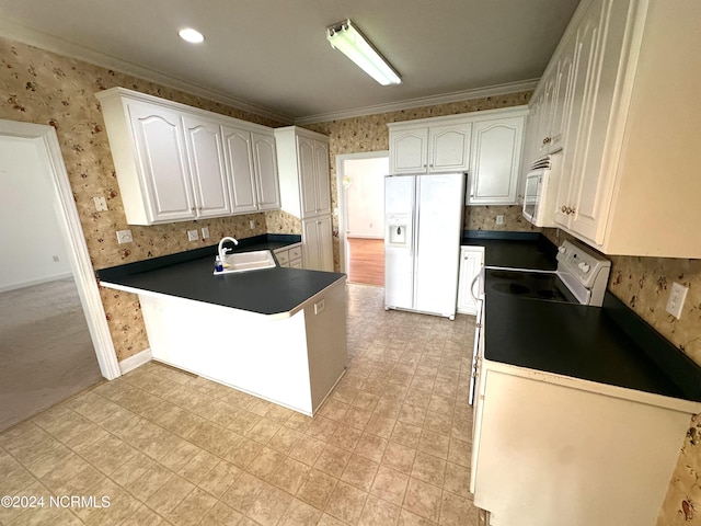 kitchen featuring a sink, wallpapered walls, dark countertops, and white appliances