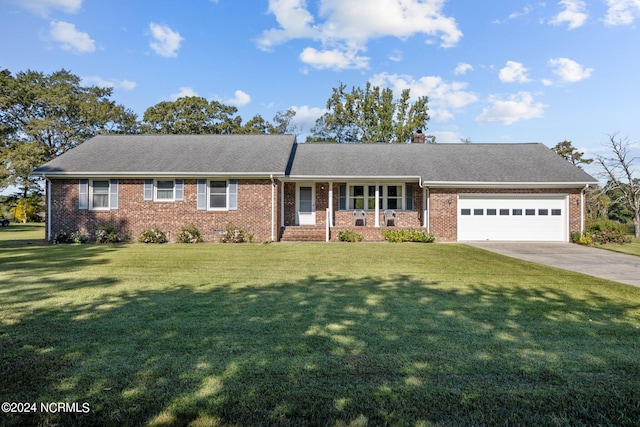 single story home featuring a front lawn and a garage