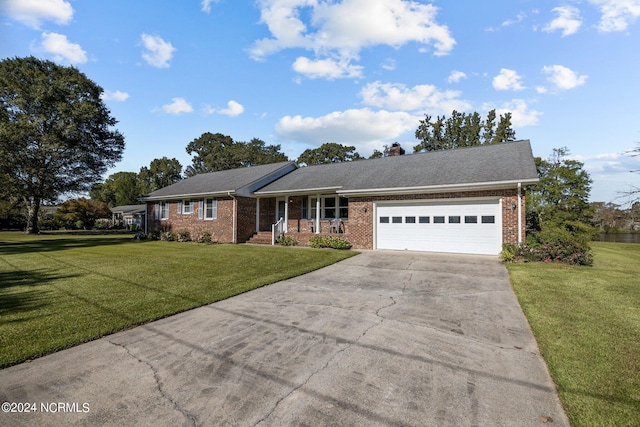 ranch-style house with a garage and a front yard