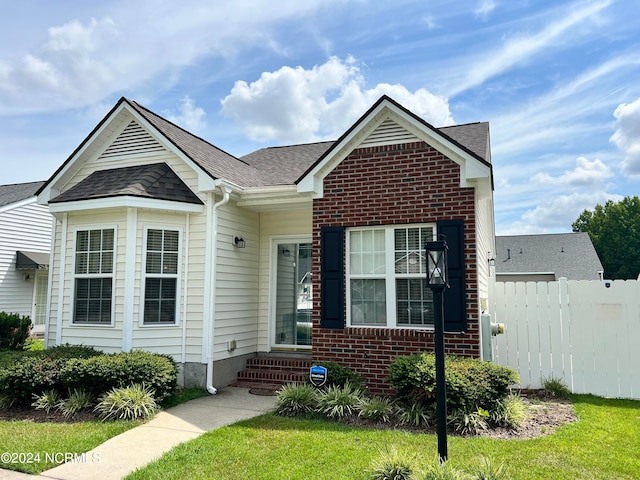 view of front of home with a front lawn