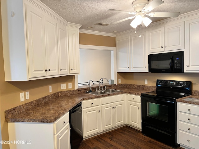 kitchen with white cabinets, a textured ceiling, black appliances, crown molding, and dark hardwood / wood-style floors