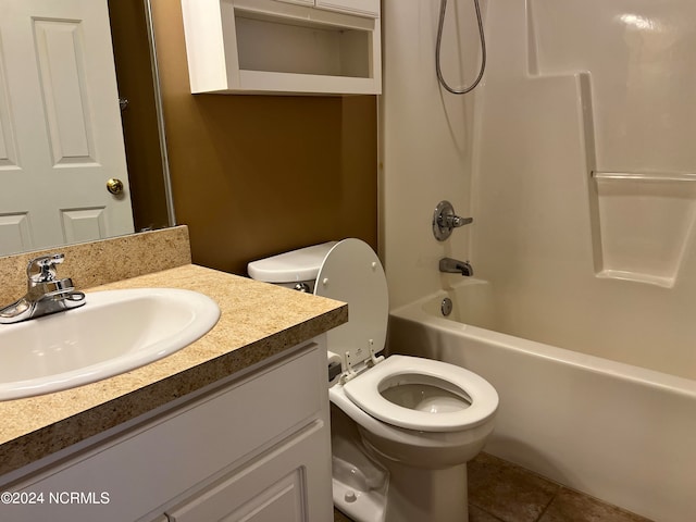 full bathroom featuring tile patterned floors, bathing tub / shower combination, vanity, and toilet