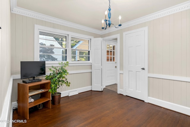 home office with ornamental molding, a notable chandelier, wooden walls, and dark wood-type flooring