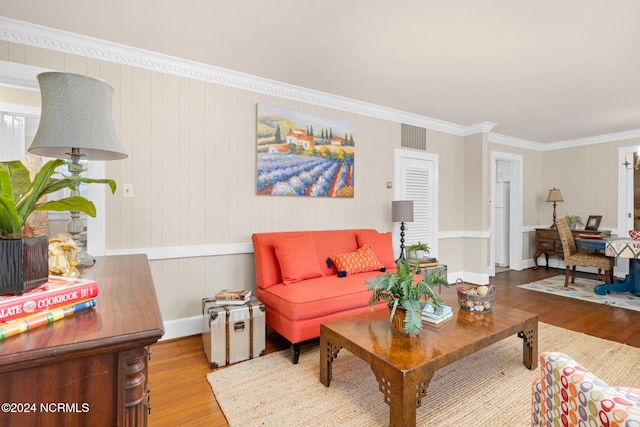 living room featuring crown molding and hardwood / wood-style flooring