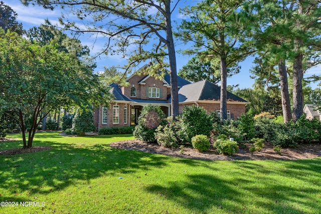 view of front of home with a front lawn