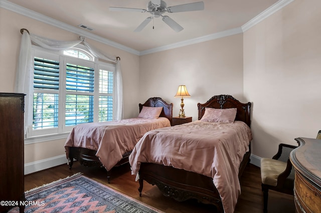 bedroom featuring dark wood-type flooring, ceiling fan, and ornamental molding