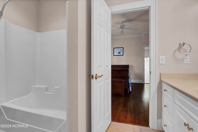 bathroom featuring vanity, crown molding, ceiling fan, and hardwood / wood-style floors