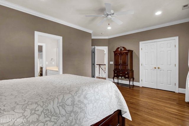 bedroom with a closet, ceiling fan, connected bathroom, crown molding, and dark hardwood / wood-style floors