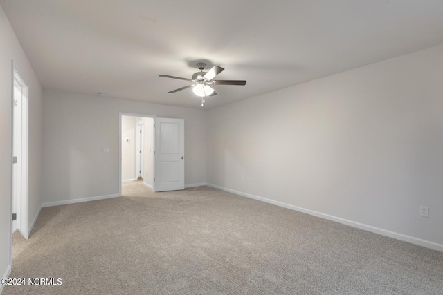 empty room with light carpet and ceiling fan