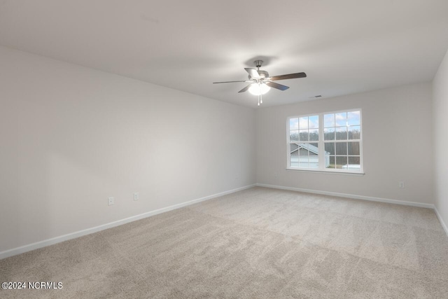 empty room with light carpet and ceiling fan