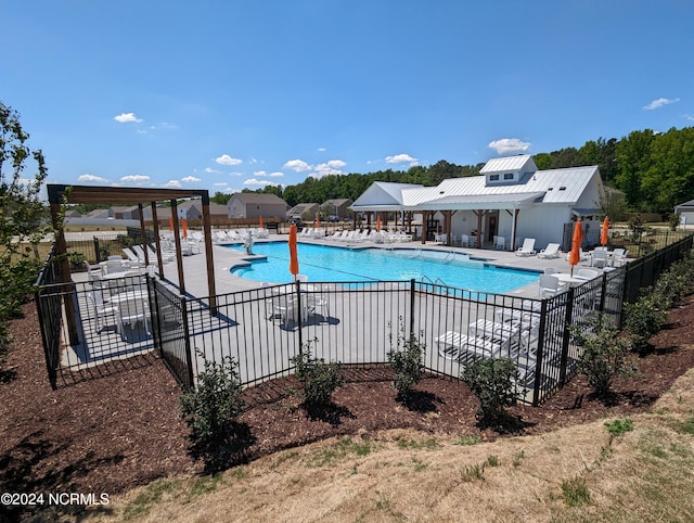 view of swimming pool with a patio area