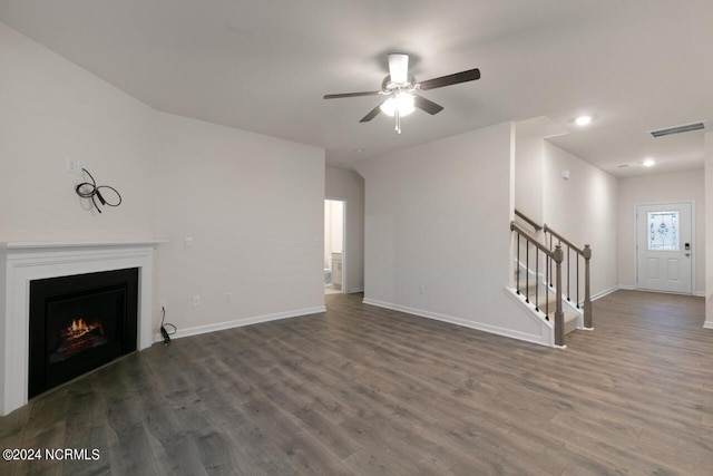 unfurnished living room with vaulted ceiling, ceiling fan, and dark hardwood / wood-style flooring