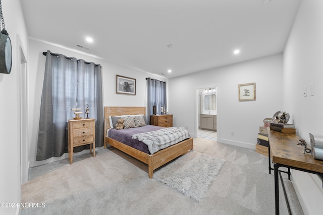 carpeted bedroom with connected bathroom