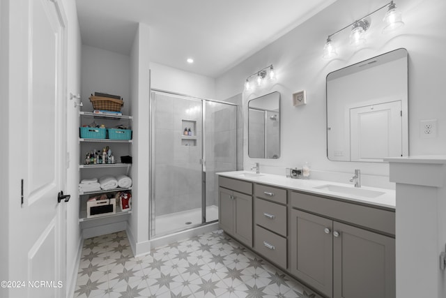 bathroom with vanity and walk in shower