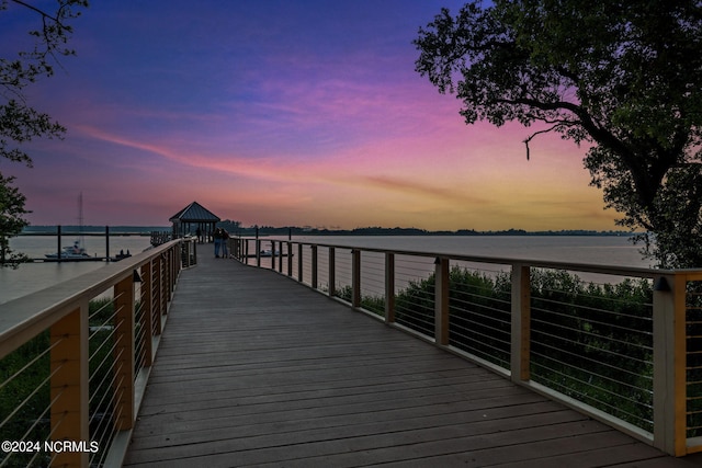 dock area with a gazebo and a water view