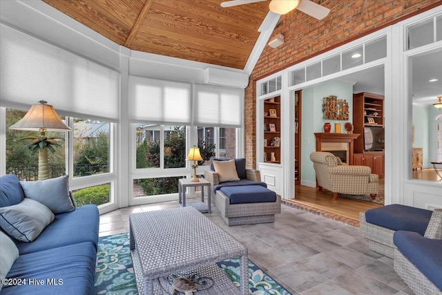 sunroom / solarium featuring wood ceiling, vaulted ceiling, a wall mounted air conditioner, and ceiling fan