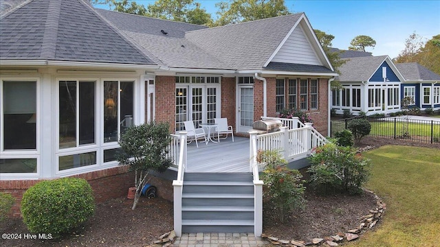 back of house featuring a yard and a wooden deck