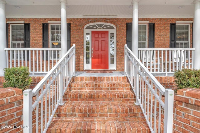 doorway to property with covered porch