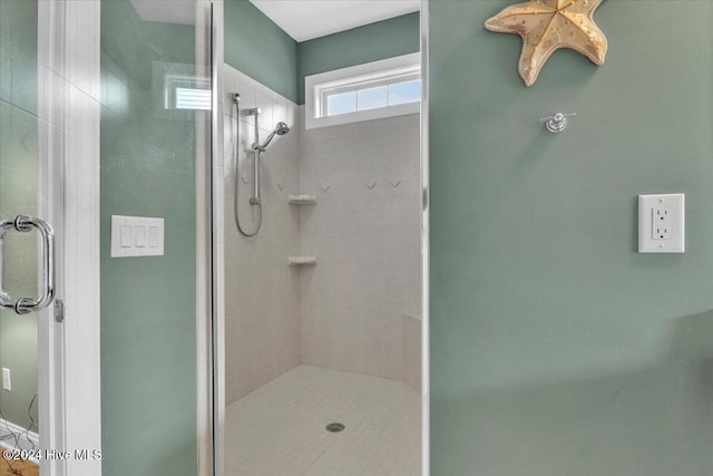 bathroom featuring an enclosed shower