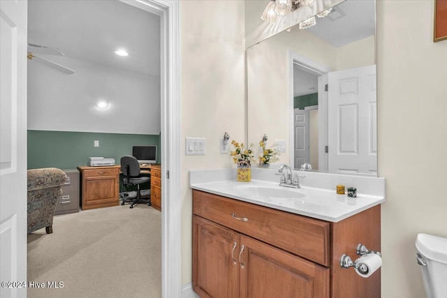 bathroom with ceiling fan, vanity, and toilet