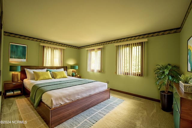 bedroom featuring light carpet