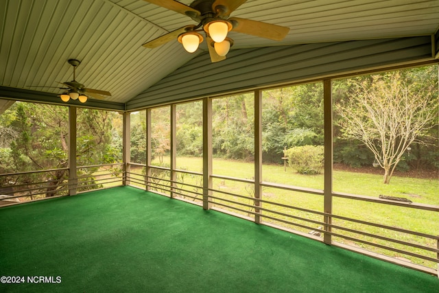 unfurnished sunroom with ceiling fan and lofted ceiling