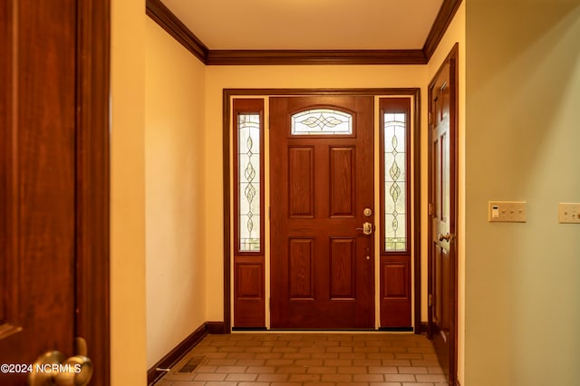 entrance foyer featuring crown molding