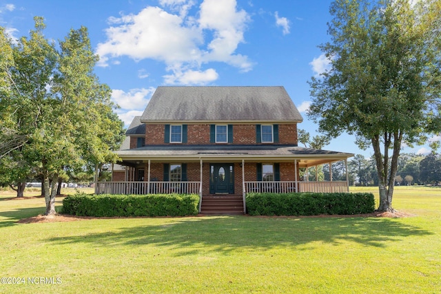 view of front of home featuring a front lawn and covered porch