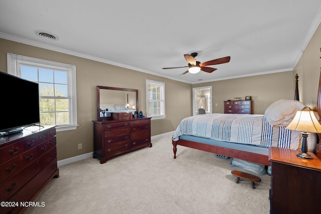 carpeted bedroom featuring ceiling fan and ornamental molding