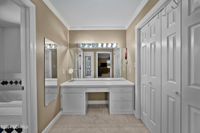 bathroom with crown molding and vanity