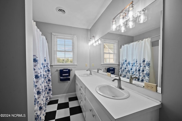 bathroom featuring vanity and a healthy amount of sunlight