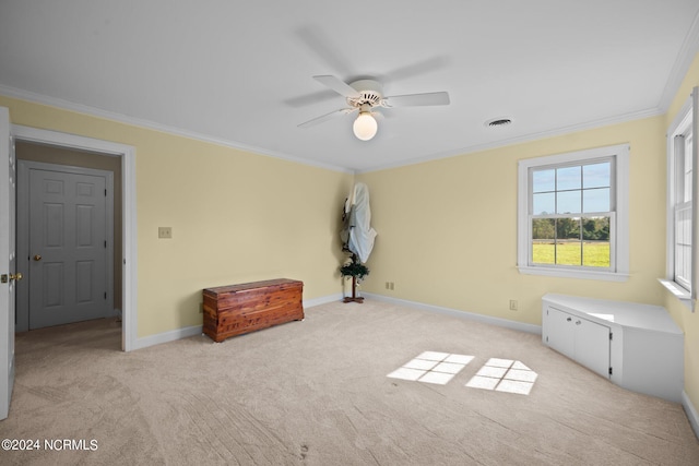 unfurnished bedroom with ornamental molding, ceiling fan, and light colored carpet