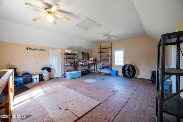 interior space featuring lofted ceiling and ceiling fan