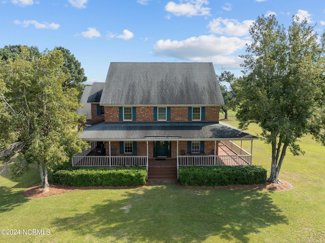 view of front of home with a front lawn and covered porch