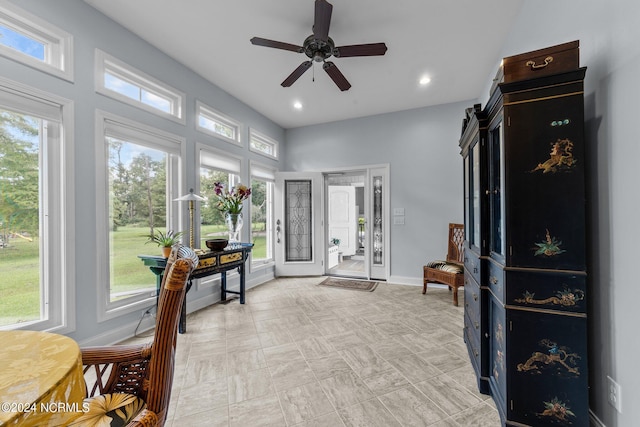 interior space featuring recessed lighting, a healthy amount of sunlight, baseboards, and ceiling fan
