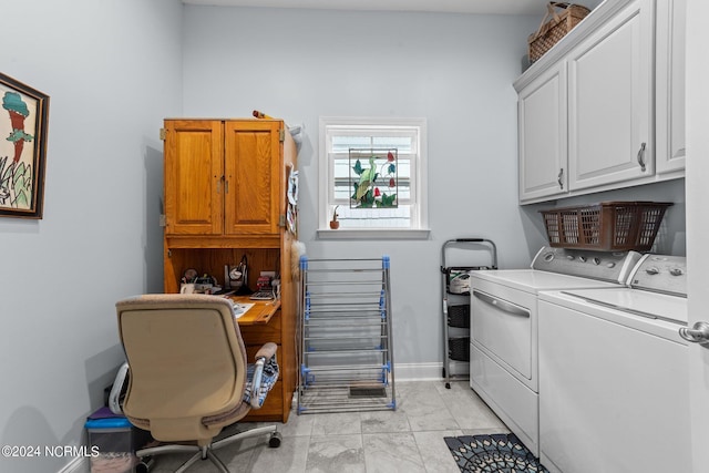 clothes washing area featuring cabinet space, baseboards, marble finish floor, and washer and dryer