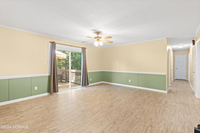 empty room featuring ornamental molding, light wood-type flooring, ceiling fan, and a textured ceiling