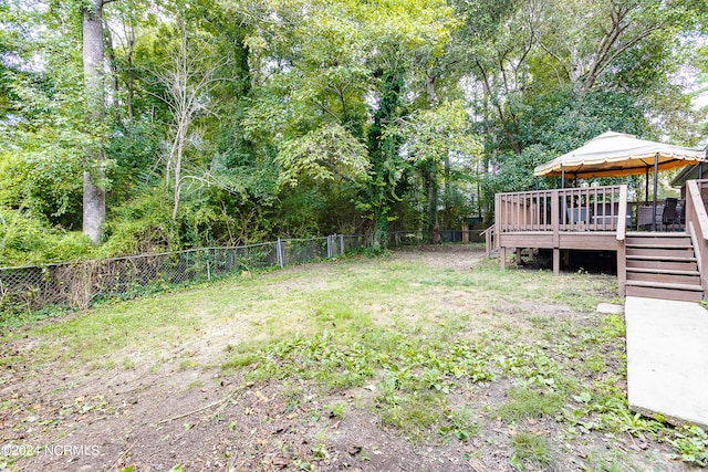 view of yard featuring a gazebo and a deck