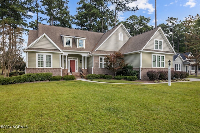 craftsman-style house with a front lawn