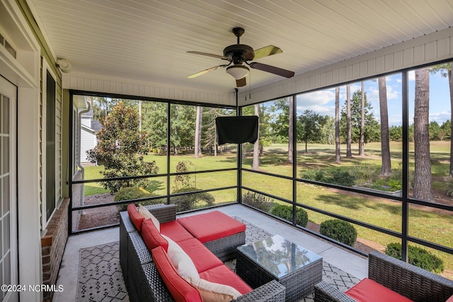 sunroom / solarium featuring ceiling fan and plenty of natural light