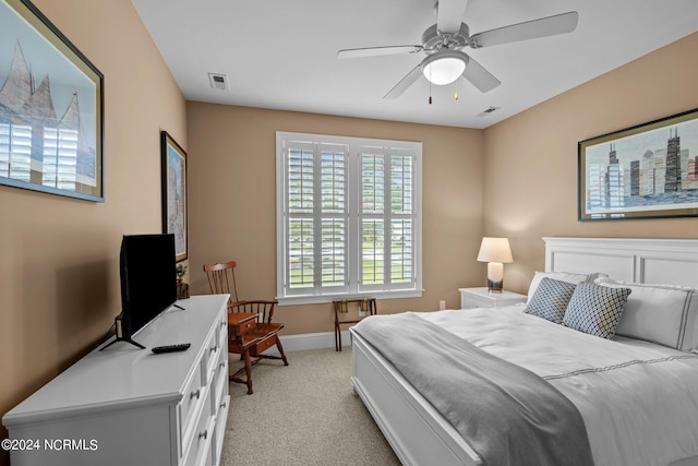 bedroom featuring ceiling fan and light colored carpet