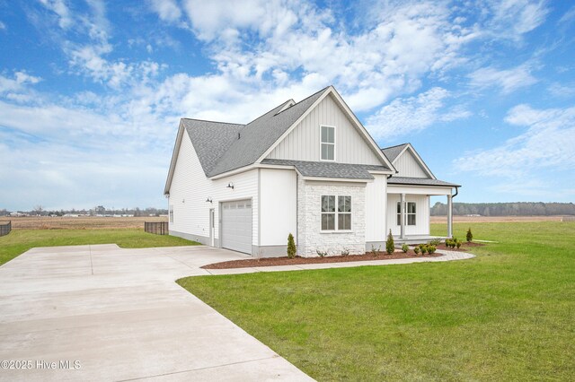 birds eye view of property with a rural view