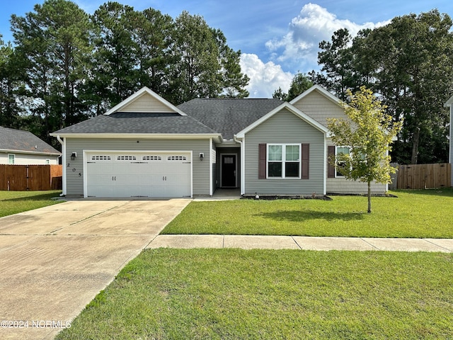 ranch-style home featuring a front yard and a garage