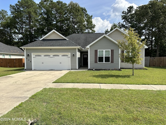 ranch-style home with a front lawn and a garage