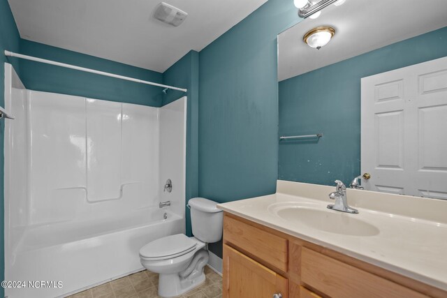 full bathroom featuring shower / bathtub combination, vanity, and toilet