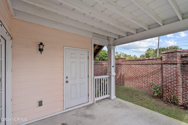 doorway to property featuring a patio area